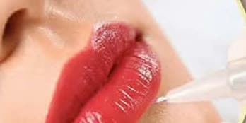 Lip color being applied with a permanent makeup pen